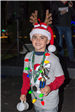Young Boy with a Reindeer Headband Holding a Mug and Trophy